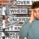 person exhaling hard while looking confused signs all around them